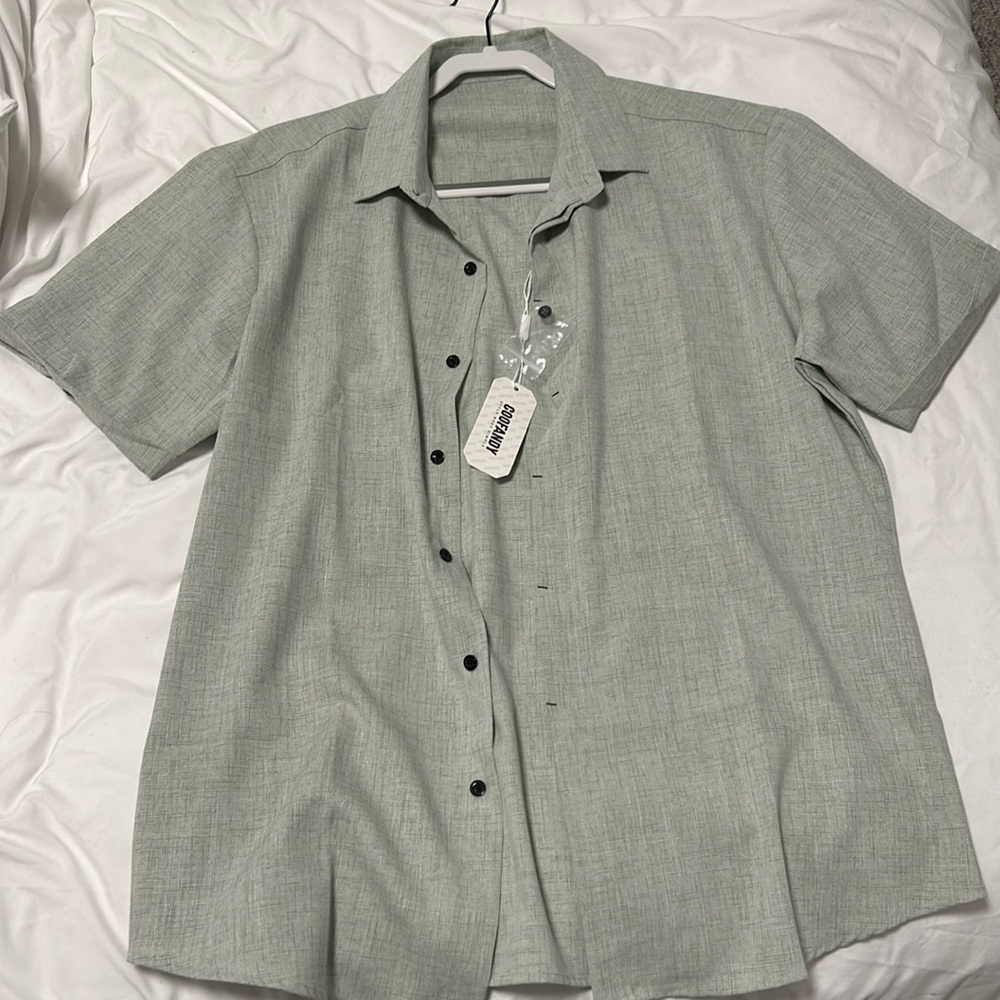 Never worn before short sleeve button down